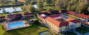 an aerial view of a house with a swimming pool at Furó Vendégház 2 in Fülöp
