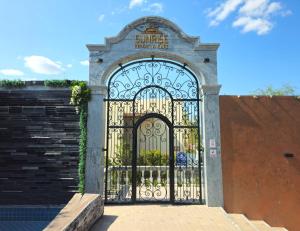 a gate with a sign that reads sunrise hotel spa at Sunrise Resort & Cafe - ซันไรส์ รีสอร์ท & คาเฟ่ in Nakhon Phanom