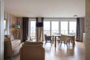 Posezení v ubytování Hotel STRAND am Königshafen