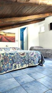 a bed with a pillow on the floor in a room at BeB il Vicoletto in Maratea