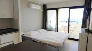 Posteľ alebo postele v izbe v ubytovaní Appartement 753, 4 personnes, vue mer By Palmazur