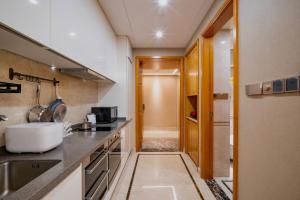 TV a/nebo společenská místnost v ubytování 柃居 B&B - Suzhou Center Apartment