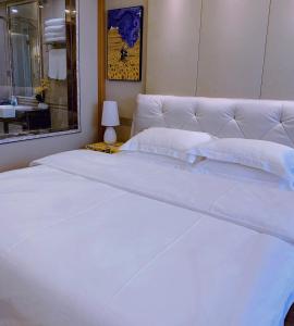 Postel nebo postele na pokoji v ubytování 柃居 B&B - Suzhou Center Apartment