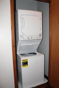a microwave sitting on top of a refrigerator at Wild Eagle Lodge, 2 bedroom 2nd floor condo, #216 in Eagle River