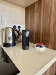 a coffeemaker sitting on top of a kitchen counter at Chill and Stay-Luxury Studio in Kato Paphos in Paphos City +40 photos