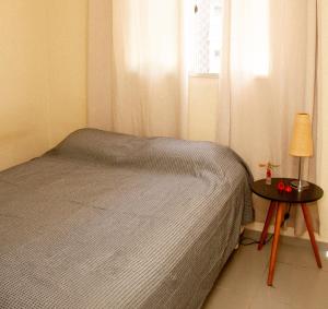 Postel nebo postele na pokoji v ubytování Apartamento Buritis 01