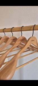 a bunch of wooden spoons hanging on a rack at Casa Moni con Vistas al Mar in Playa de Santiago
