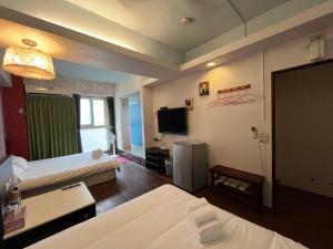 Giường trong phòng chung tại 藍晴庭