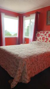 Postel nebo postele na pokoji v ubytování 2 Arenas de Ancud