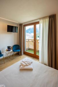 Postel nebo postele na pokoji v ubytování Agriturismo Donec
