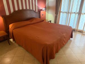 Postel nebo postele na pokoji v ubytování Hotel mariuccia