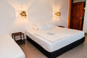 Postel nebo postele na pokoji v ubytování Casa Hotel Cautiva