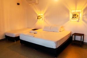 Postel nebo postele na pokoji v ubytování Casa Hotel Cautiva