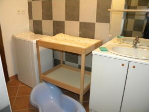 a small bathroom with a sink and a toilet at Gîte - La campagne in Sainte-Hélène-Bondeville +13 photos