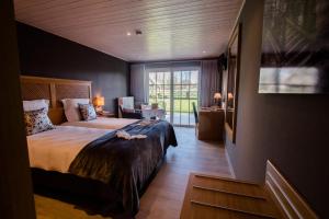 Postel nebo postele na pokoji v ubytování B&B De Bergvallei