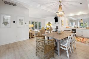 a kitchen and dining room with a table and chairs at Poolside at DeBordieu Colony in Georgetown +27 photos
