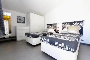 Postel nebo postele na pokoji v ubytování Residence Le Betulle Executive