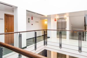 a view of the second floor hallway of a building at Monjas del Carmen Hotel in Granada