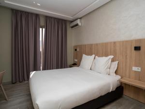 Voodi või voodid majutusasutuse HOTEL CAFE PALAIS SALAM , Beni Mellal toas