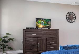a tv on top of a dresser in a room at Upscale Studio in NY with Kitchen & Serene Setting in Congers