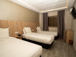Voodi või voodid majutusasutuse HOTEL CAFE PALAIS SALAM , Beni Mellal toas