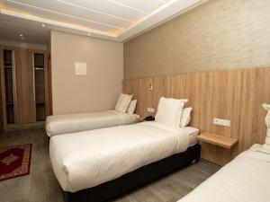 Voodi või voodid majutusasutuse HOTEL CAFE PALAIS SALAM , Beni Mellal toas