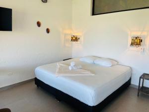 Postel nebo postele na pokoji v ubytování Casa Hotel Cautiva
