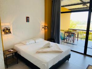 Postel nebo postele na pokoji v ubytování Casa Hotel Cautiva