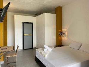 Postel nebo postele na pokoji v ubytování Casa Hotel Cautiva