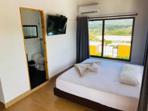Postel nebo postele na pokoji v ubytování Casa Hotel Cautiva