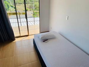 Postel nebo postele na pokoji v ubytování Casa Hotel Cautiva