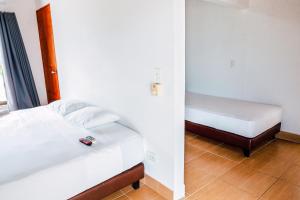 Postel nebo postele na pokoji v ubytování Casa Hotel Cautiva