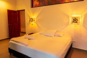 Postel nebo postele na pokoji v ubytování Casa Hotel Cautiva