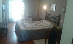 Postel nebo postele na pokoji v ubytování Hotel Casa Aurelia