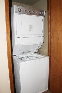 a white washer and dryer in a room at 2 Bedroom Condo at Wild Eagle Lodge, #136 in Eagle River