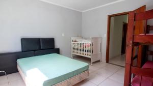 Una cama o camas en una habitación de Chacara com piscina, area gourmet equipada e Wi-Fi