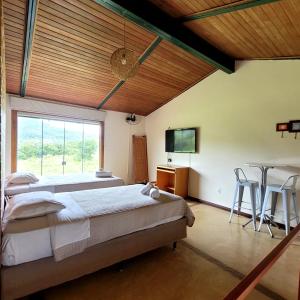 Postel nebo postele na pokoji v ubytování Espaco Morro do Frota