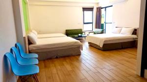 Postel nebo postele na pokoji v ubytování WOW Penghu Homestay