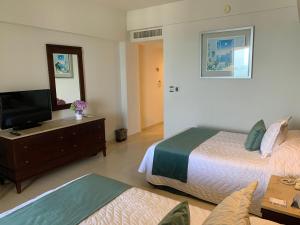 TV a/nebo společenská místnost v ubytování Hotel Bello Veracruz