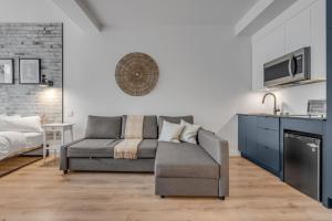 a living room with a couch and a bed at Initial / Simplicity / Québec in Quebec City +22 photos