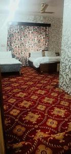 Voodi või voodid majutusasutuse Hotel Kashmir Heaven toas