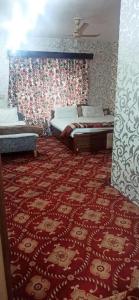 Voodi või voodid majutusasutuse Hotel Kashmir Heaven toas
