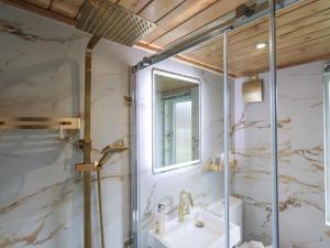 a bathroom with a sink and a shower at Our Happy Place in Carnforth +27 photos