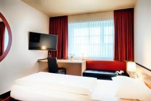 TV a/nebo společenská místnost v ubytování Welcome Kongress Hotel Bamberg