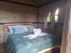 Postel nebo postele na pokoji v ubytování Alma Cabañas y Spa