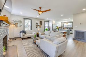 a living room with a couch and a fireplace at 4 Mi to Liberty Bridge Greenville Getaway with Deck in Greenville