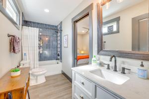 a bathroom with a sink and a toilet at 4 Mi to Liberty Bridge Greenville Getaway with Deck in Greenville +24 photos