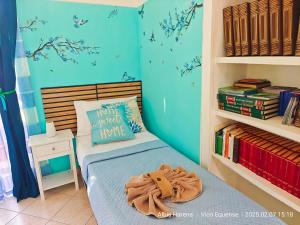 a bedroom with a bed with a teddy bear on it at Manù Apartment in Vico Equense