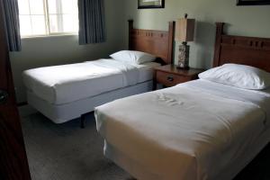 a hotel room with two beds and a window at 2 Bedroom accessible condo in Eagle River
