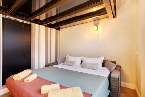 a bedroom with a bed with two pillows on it at Dezza Loft in Milan